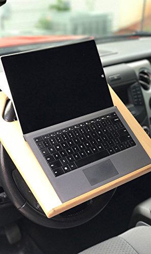 The Notebook steering wheel desk measures 15″ × 13 1/8.″ This compact WheelDesk provides a stable surface for most laptops, tablets, phones, or paperwork.