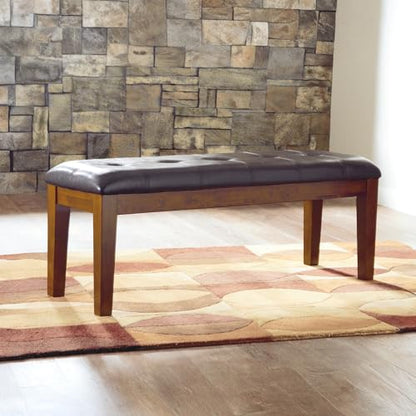 Signature Design by Ashley Ralene Tufted Upholstered Dining Room Bench, Medium Brown | Plush wipe-clean faux leather cushion, Frame of veneers, wood and engineered wood, Versatile 2-person entryway seating - color: Medium Brown, style: Ralene Dining Bench